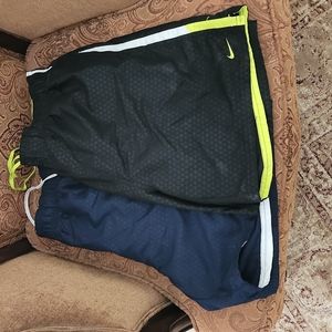 Two Nike men's swimming trunks